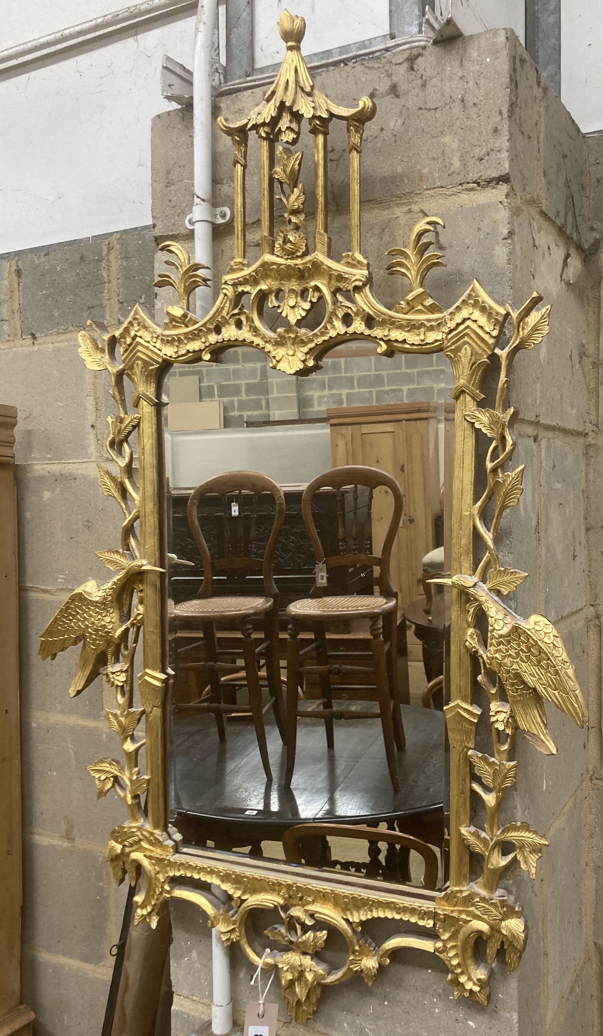 A George III style decorative carved giltwood wall mirror, width 63cm, height 106cm